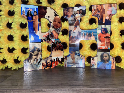 Custom Letters "B" and "F" by Keep It Sweet & Sassy Designs, adorned with various personal photographs, placed in front of a wall decorated with bright yellow sunflowers, add a personalized touch. The letters rest on a gray wooden surface.